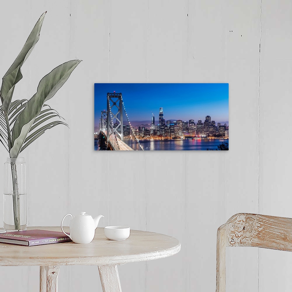 A farmhouse room featuring Photograph of the Bay Bridge and the San Francisco skyline lit up at dusk.
