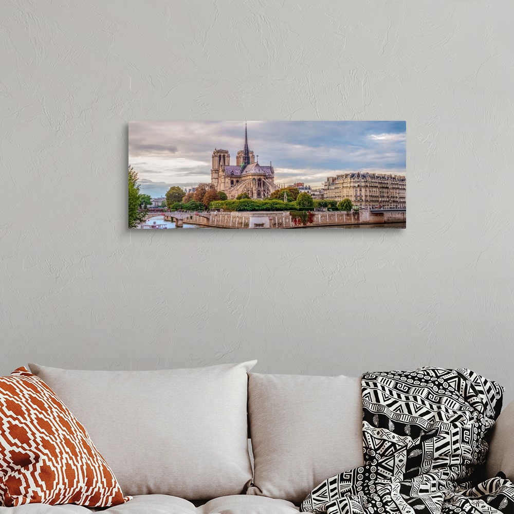 A bohemian room featuring Panoramic photograph of the backside of Notre Dame.