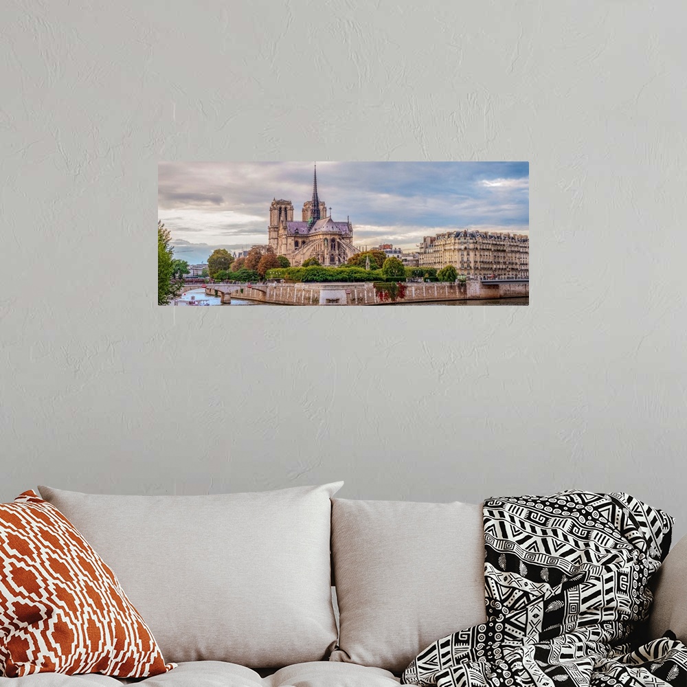 A bohemian room featuring Panoramic photograph of the backside of Notre Dame.