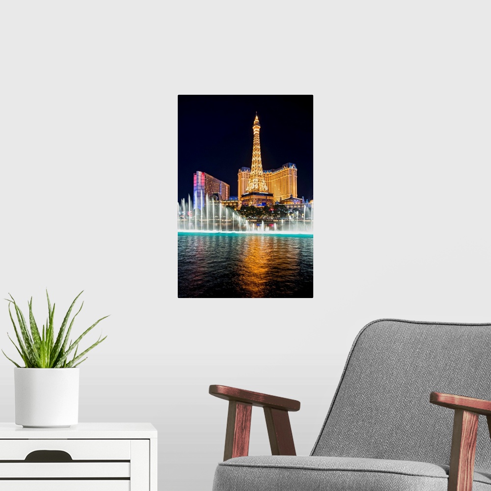 A modern room featuring Photograph of the Bellagio Water Show outside of the Bellagio, Ballys, and the Eiffel Tower at ni...