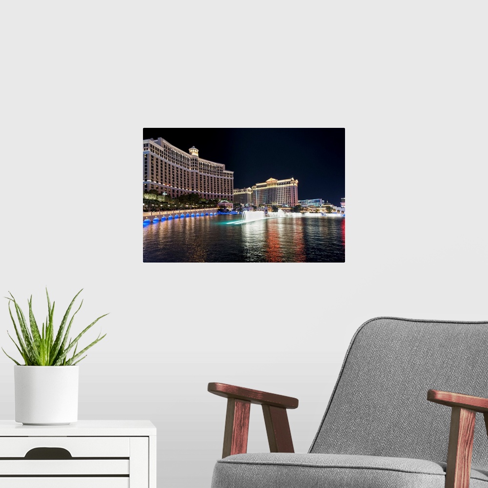 A modern room featuring Photograph of the Bellagio Water Show outside of the Bellagio and Caesar's Palace in Las Vegas, NV.