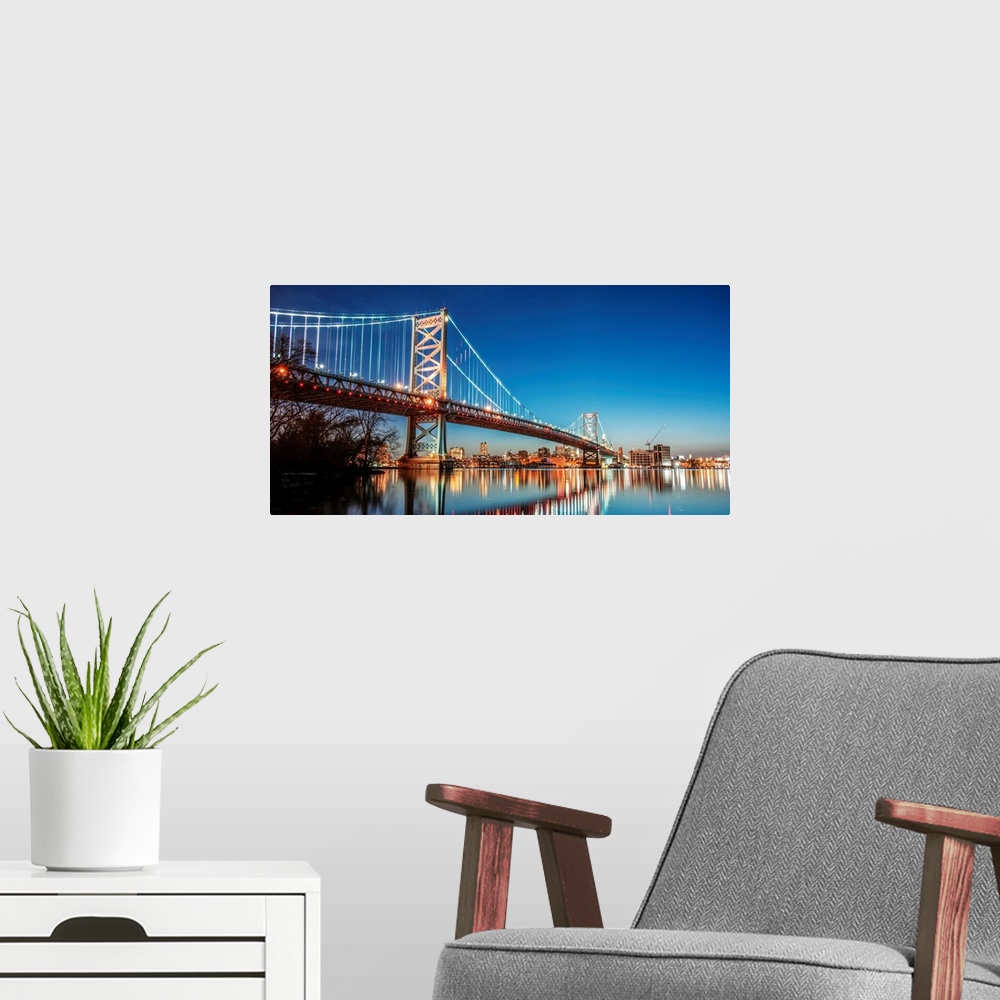 A modern room featuring View of Ben Franklin Bridge in Philadelphia at night.