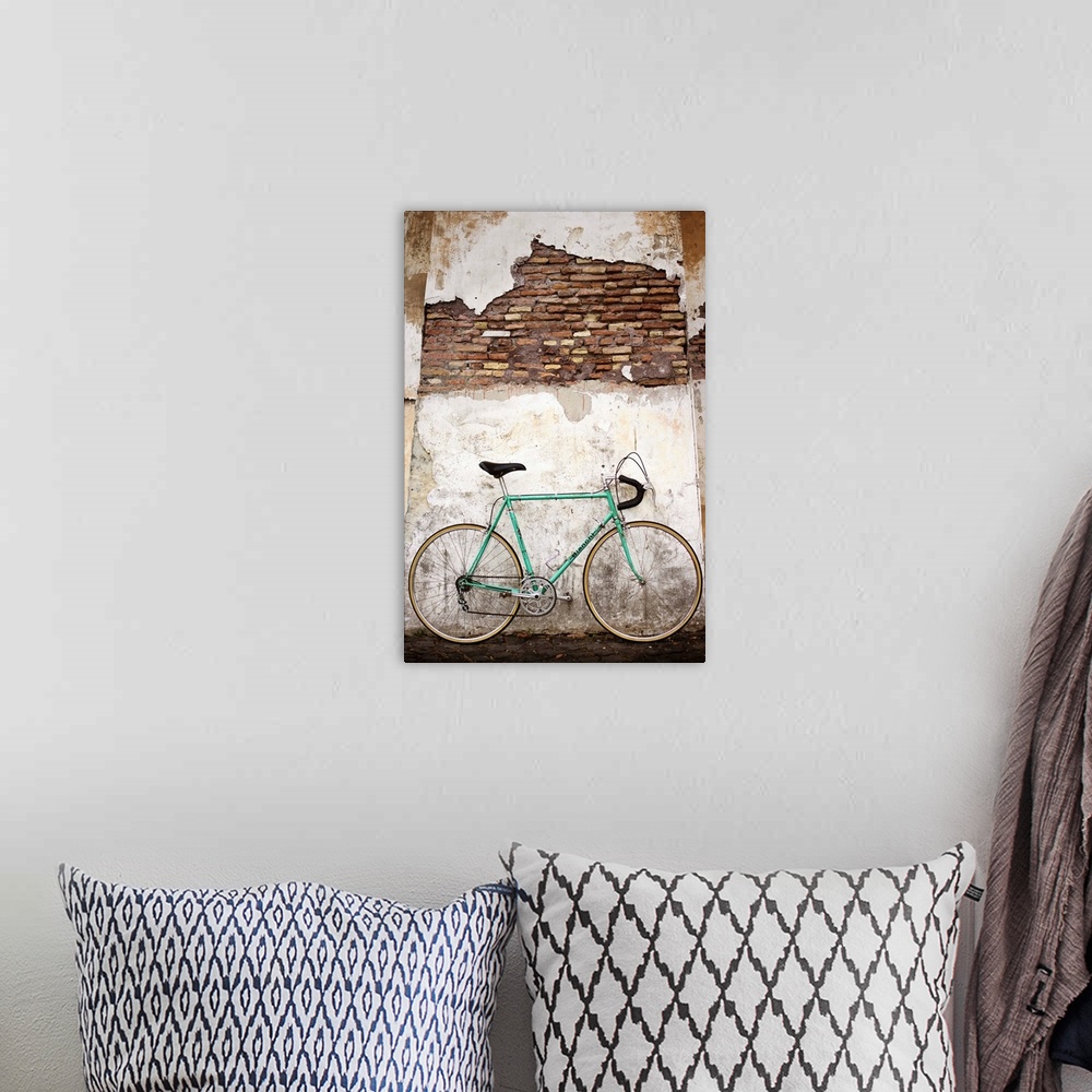 A bohemian room featuring Photograph of a bicycle leaning up against an old wall in Rome.