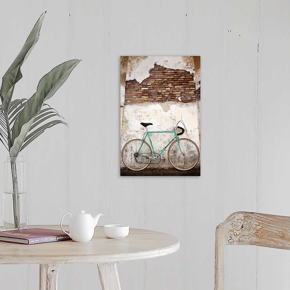 A farmhouse room featuring Photograph of a bicycle leaning up against an old wall in Rome.