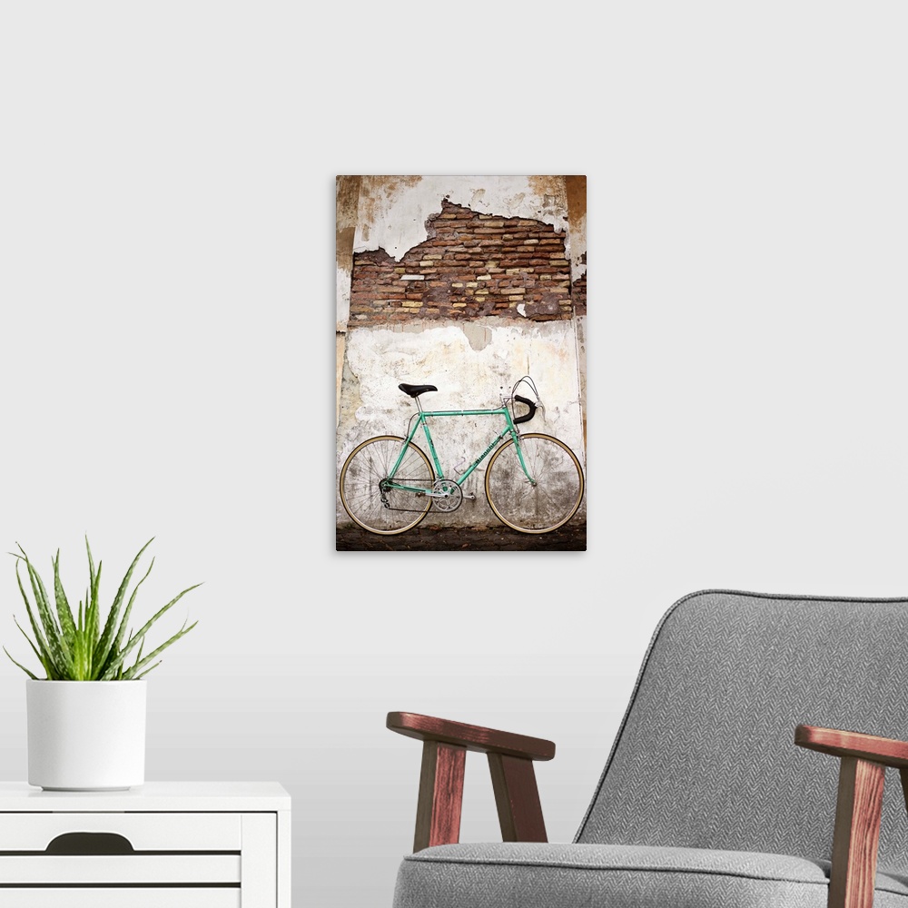 A modern room featuring Photograph of a bicycle leaning up against an old wall in Rome.