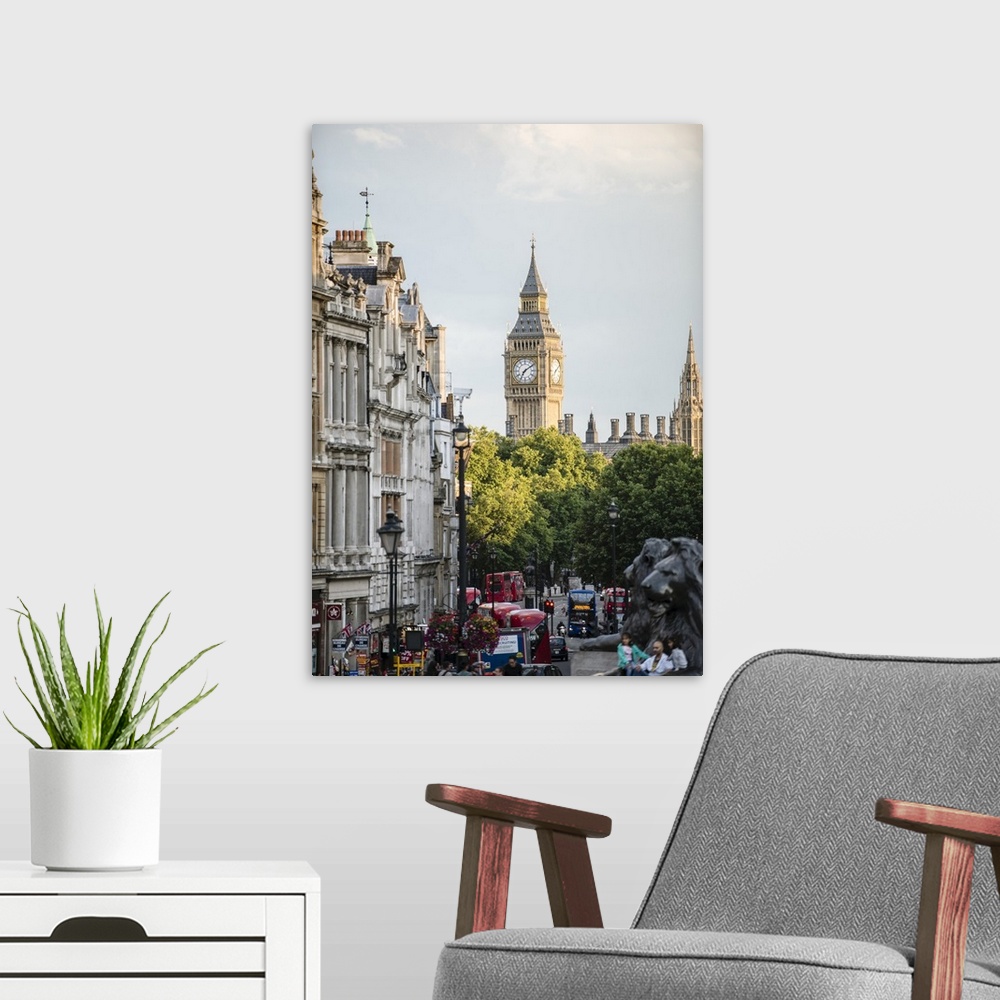 A modern room featuring Photograph taken from Trafalgar Square with the lions blurred in the foreground and Big Ben in th...