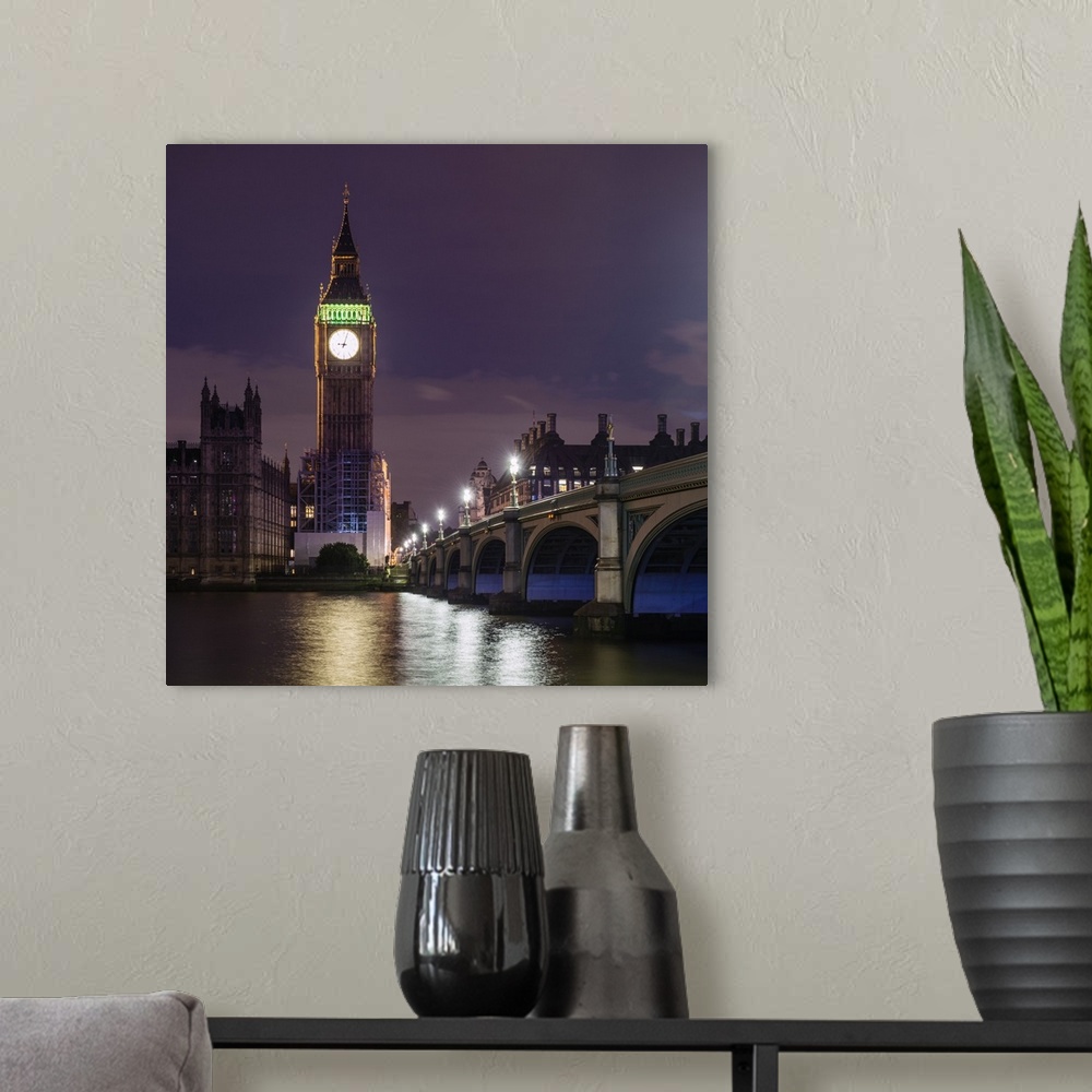 A modern room featuring Square photograph of Big Ben lit up at dusk with the Westminster Bridge and River Thames in the f...