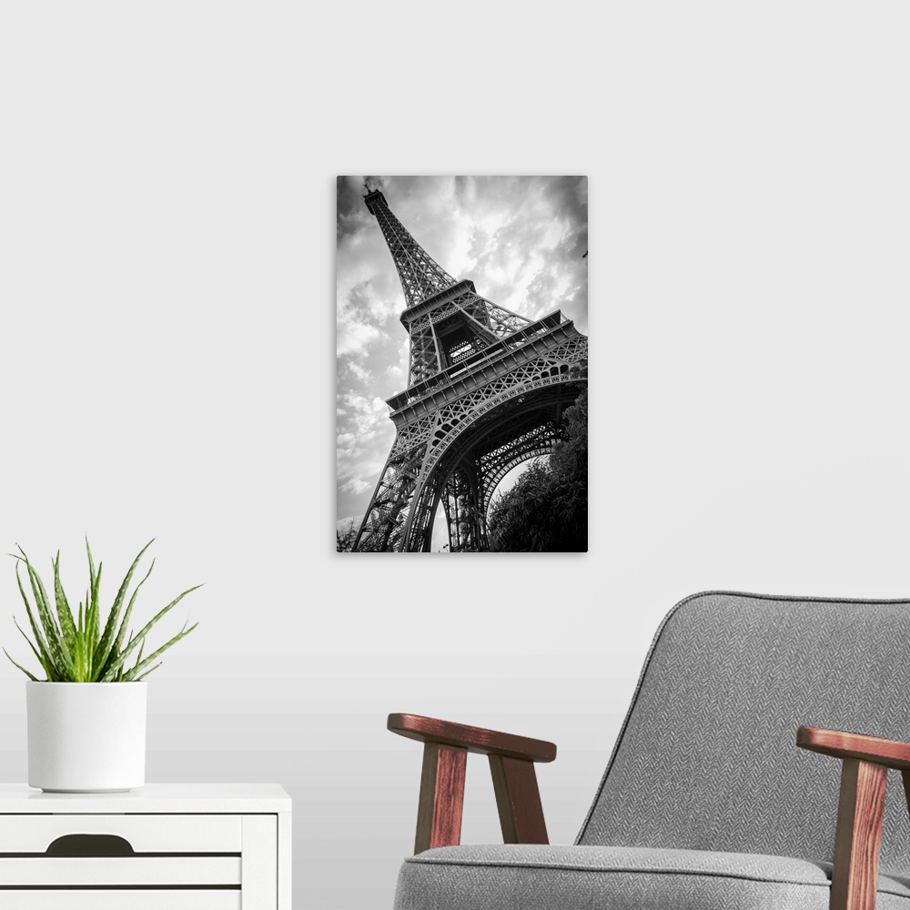 A modern room featuring Black and white photograph of he Eiffel Tower from a unique angle.