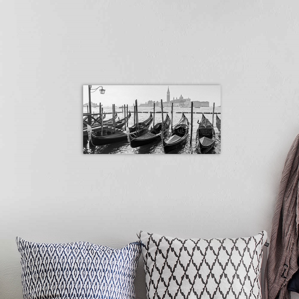 A bohemian room featuring Black and white photograph of a row of gondolas in front of Piazza San Marco (St. Mark's Square) ...