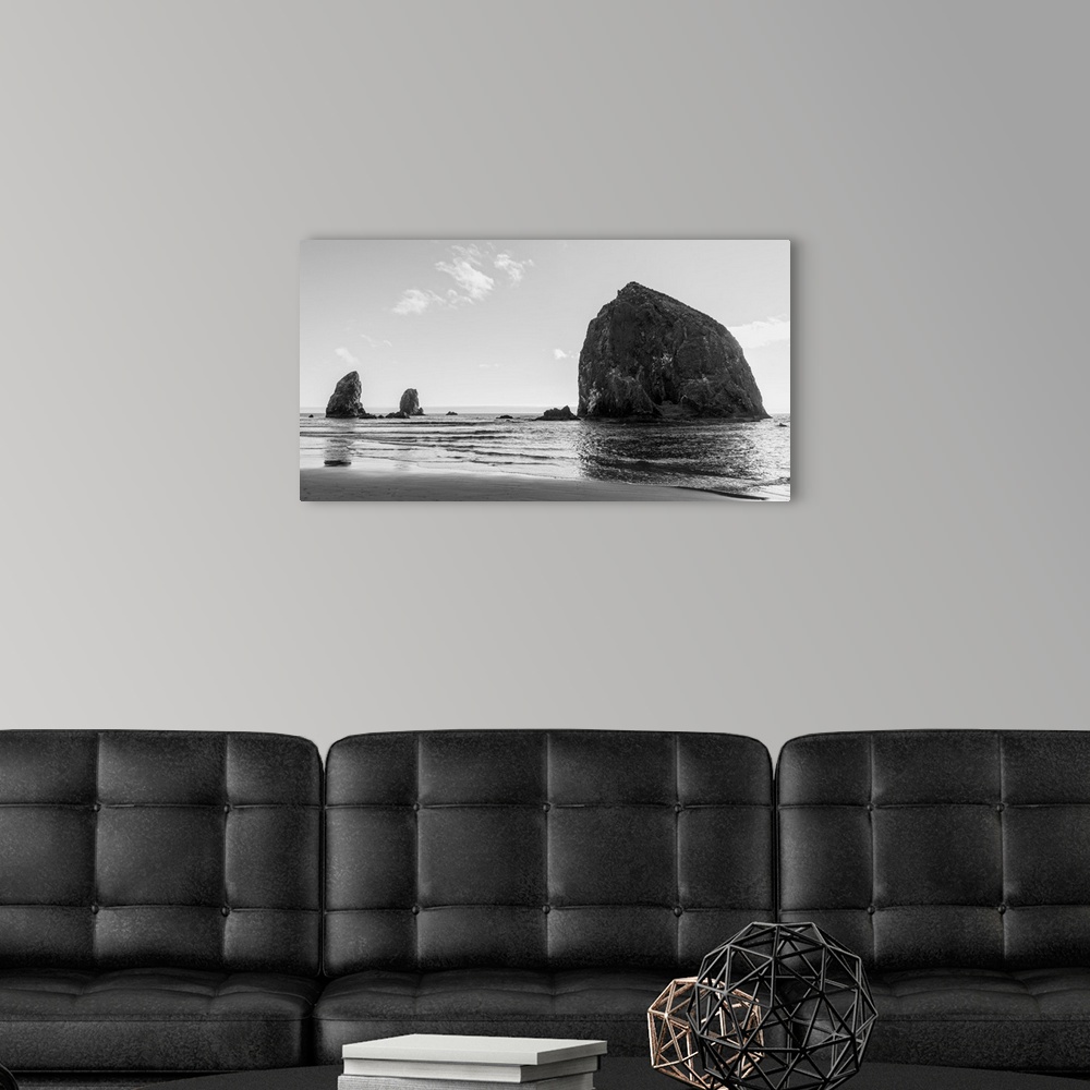 A modern room featuring Black and white photograph of Haystack Rock in Oregon.