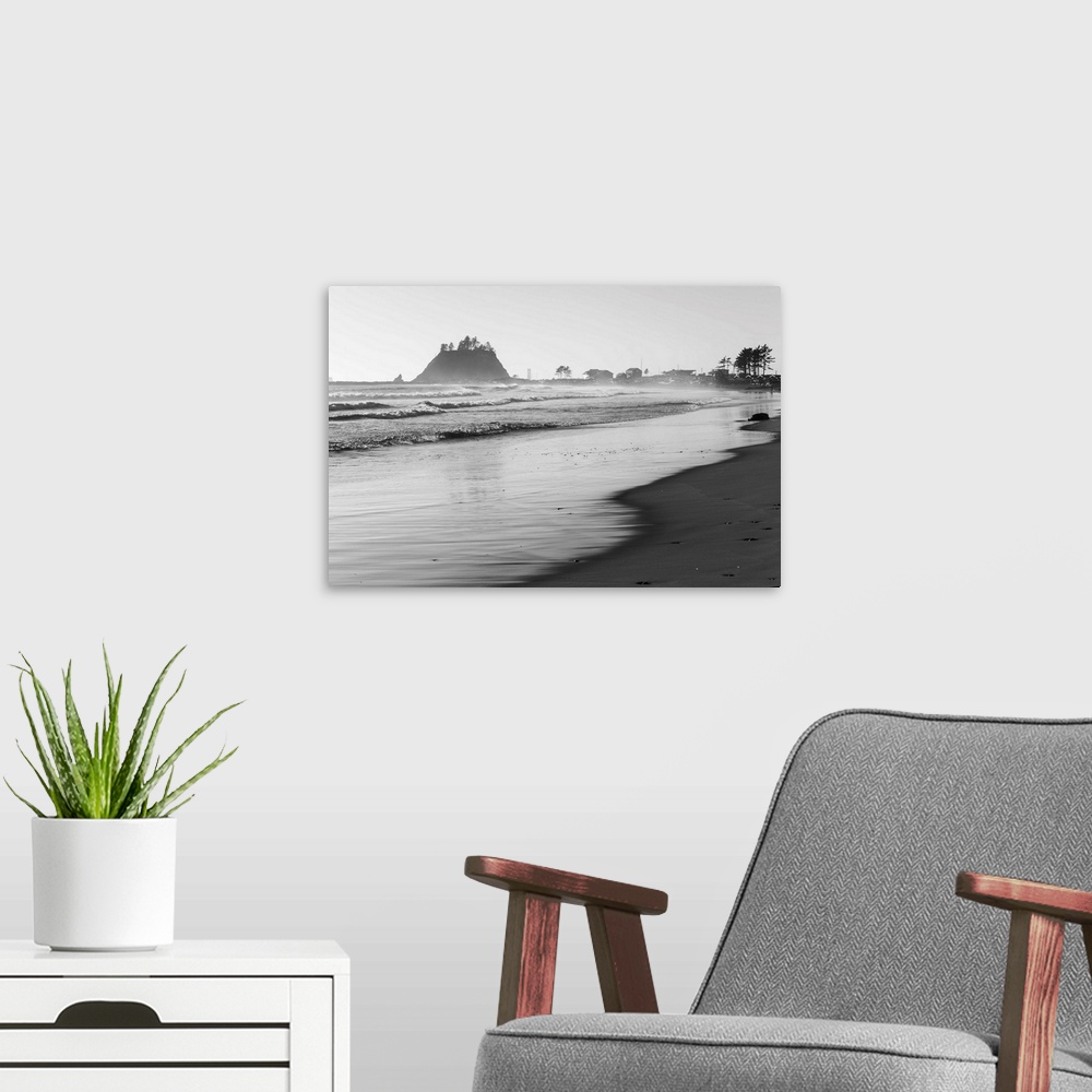 A modern room featuring Black and white landscape photograph of the La Push Beach shore with misty rock cliffs in the bac...