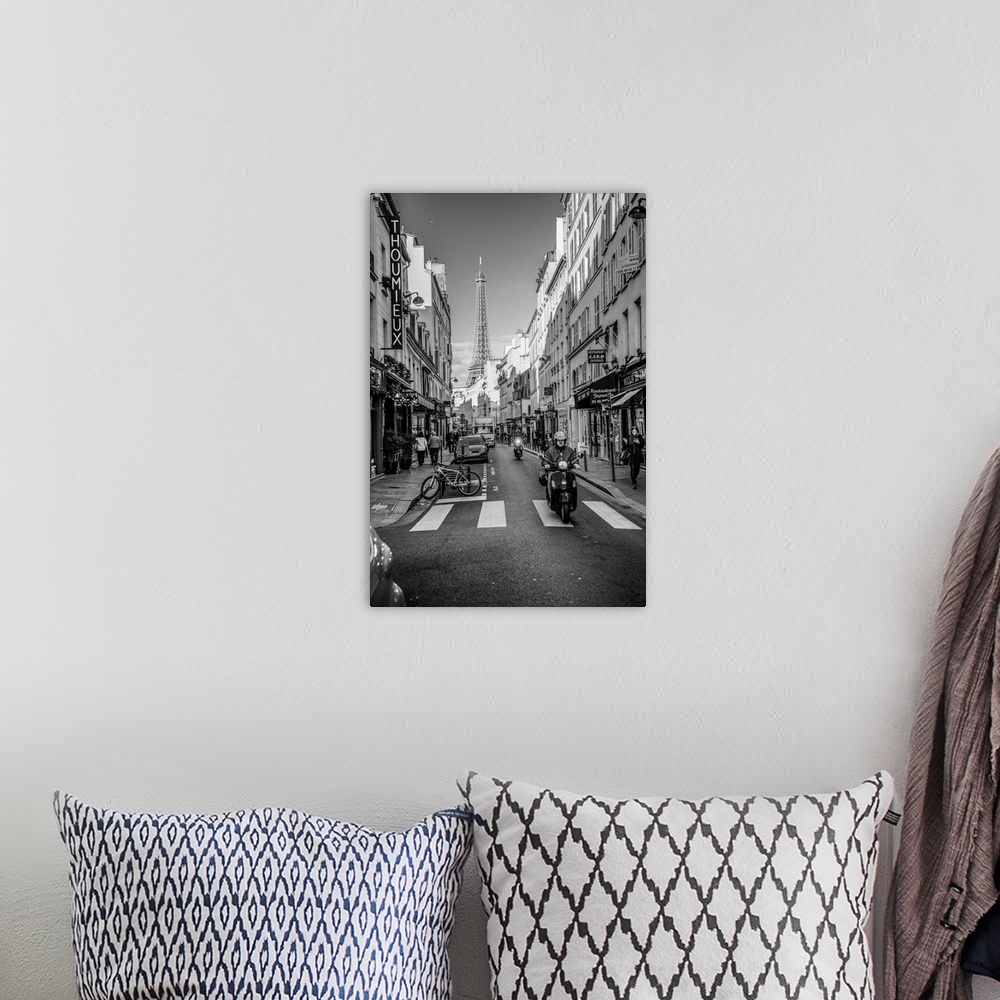 A bohemian room featuring Black and white photograph of a street view in Paris with the Eiffel Tower in the background and ...