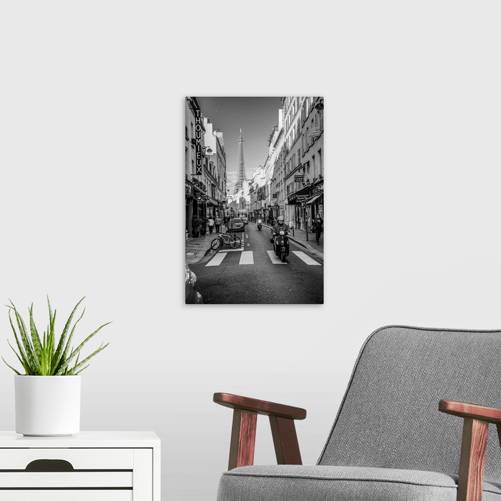 A modern room featuring Black and white photograph of a street view in Paris with the Eiffel Tower in the background and ...