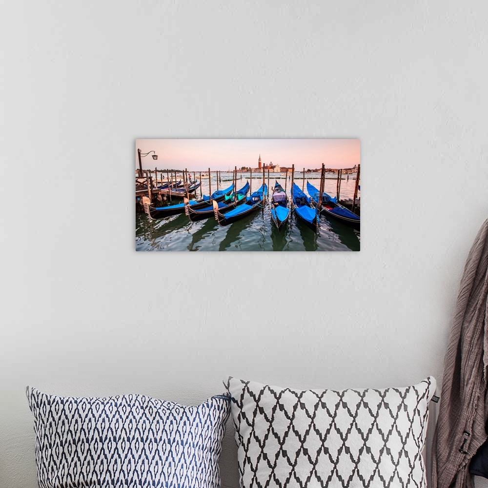 A bohemian room featuring Panoramic photograph of blue gondolas docked in a row on the water with St. Mark's Square in the ...