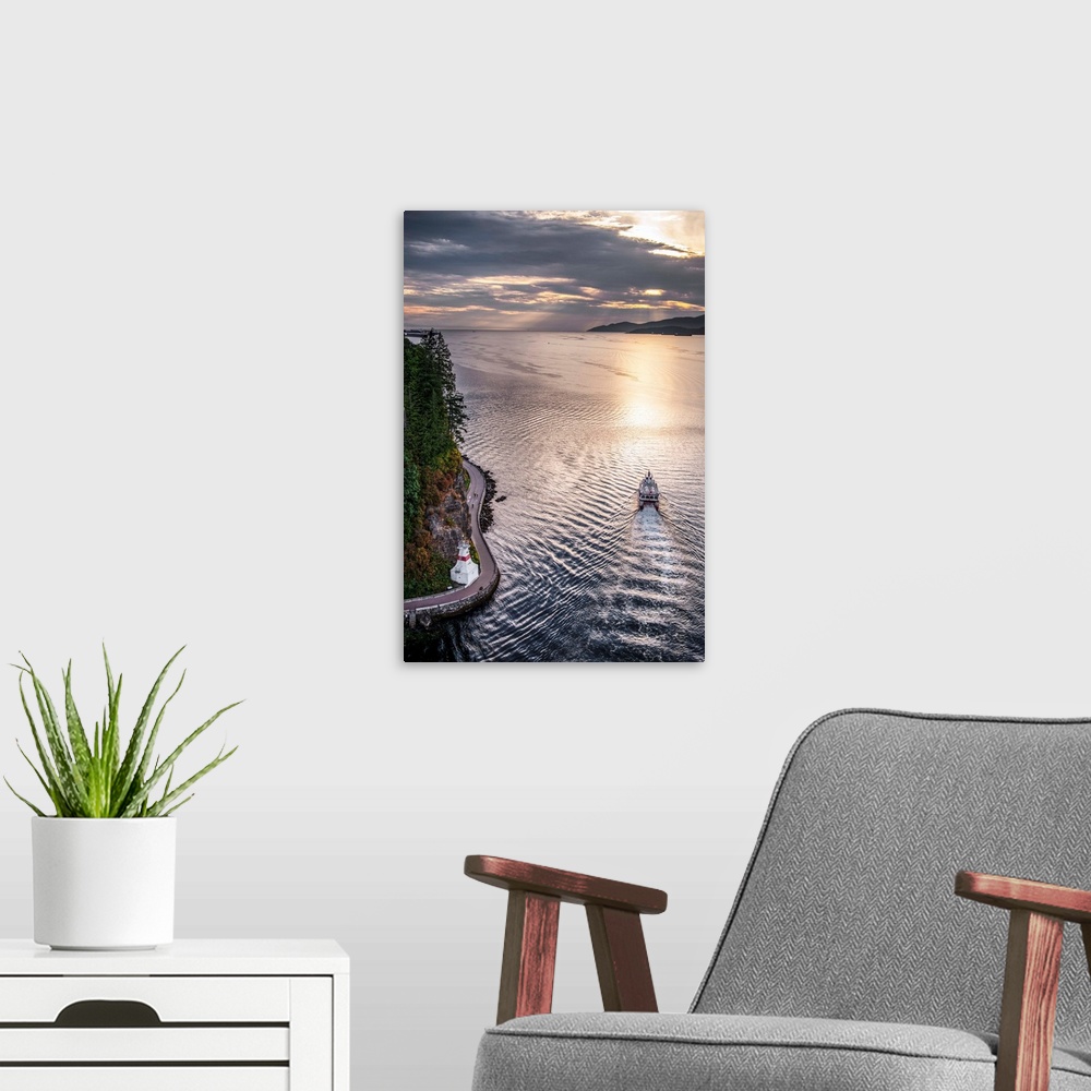 A modern room featuring Aerial view of boat in Burrard Inlet with Stanley Park Seawall Path in Vancouver, British Columbi...