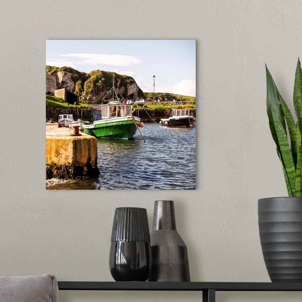 A modern room featuring Square photograph of docked boats on the coast in Dublin, Ireland.