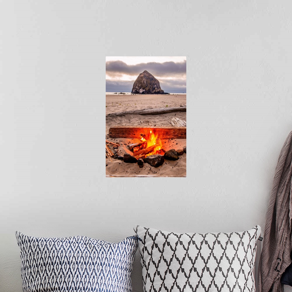 A bohemian room featuring Photograph of a fire on the beach with Haystack Rock in the background at Cannon Beach, Oregon.
