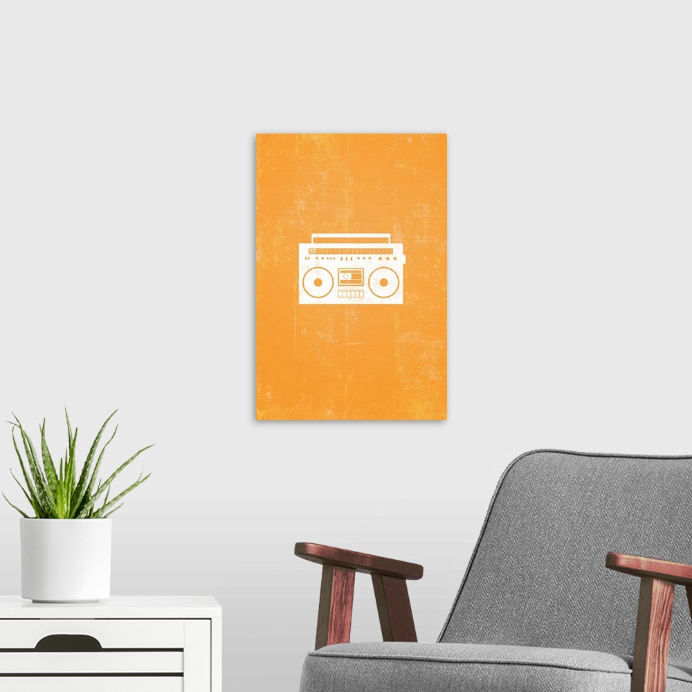 A modern room featuring Retro artwork that has a silhouette of a boom box against a bright orange background.