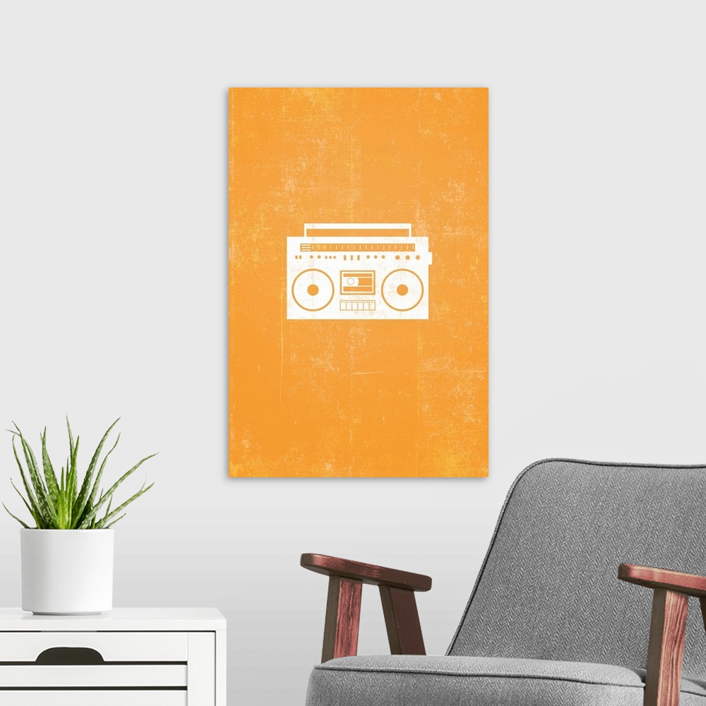 A modern room featuring Retro artwork that has a silhouette of a boom box against a bright orange background.