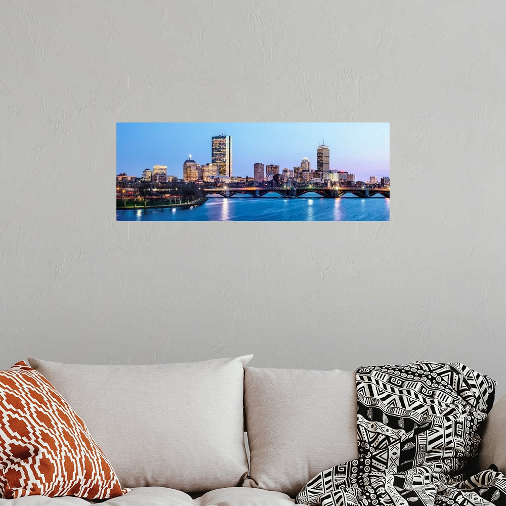 A bohemian room featuring Panoramic view of the Boston City skyline illuminated at night, with the Longfellow Bridge in the...