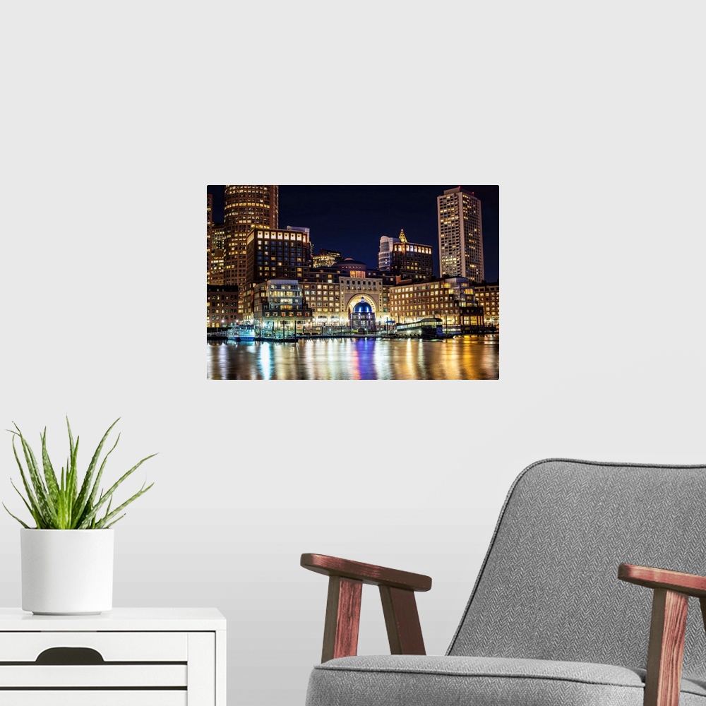A modern room featuring View of Boston city skyscrapers and the Marina at Rowes Wharf.