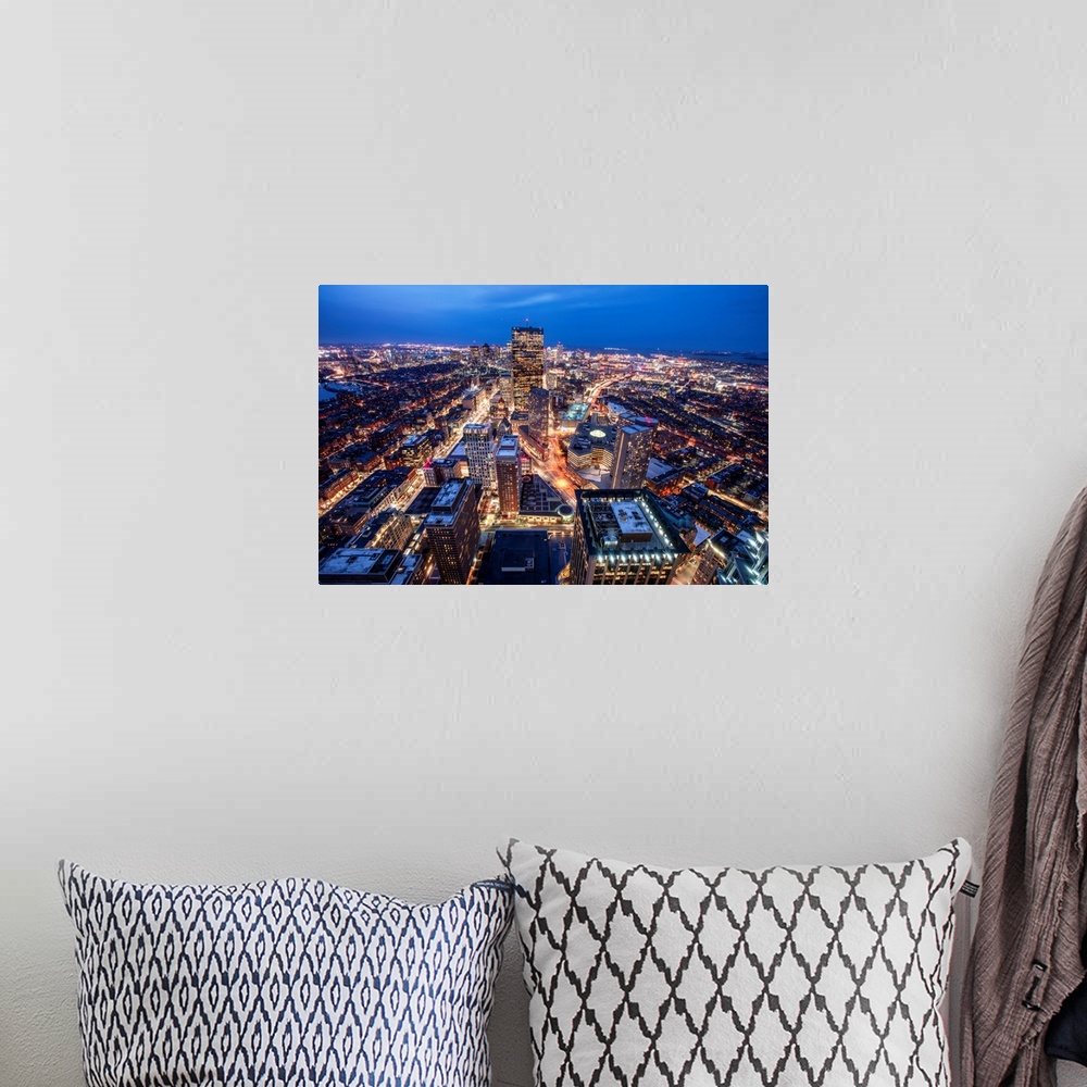 A bohemian room featuring Photo of Boston cityscape at night featuring the John Hancock Tower.