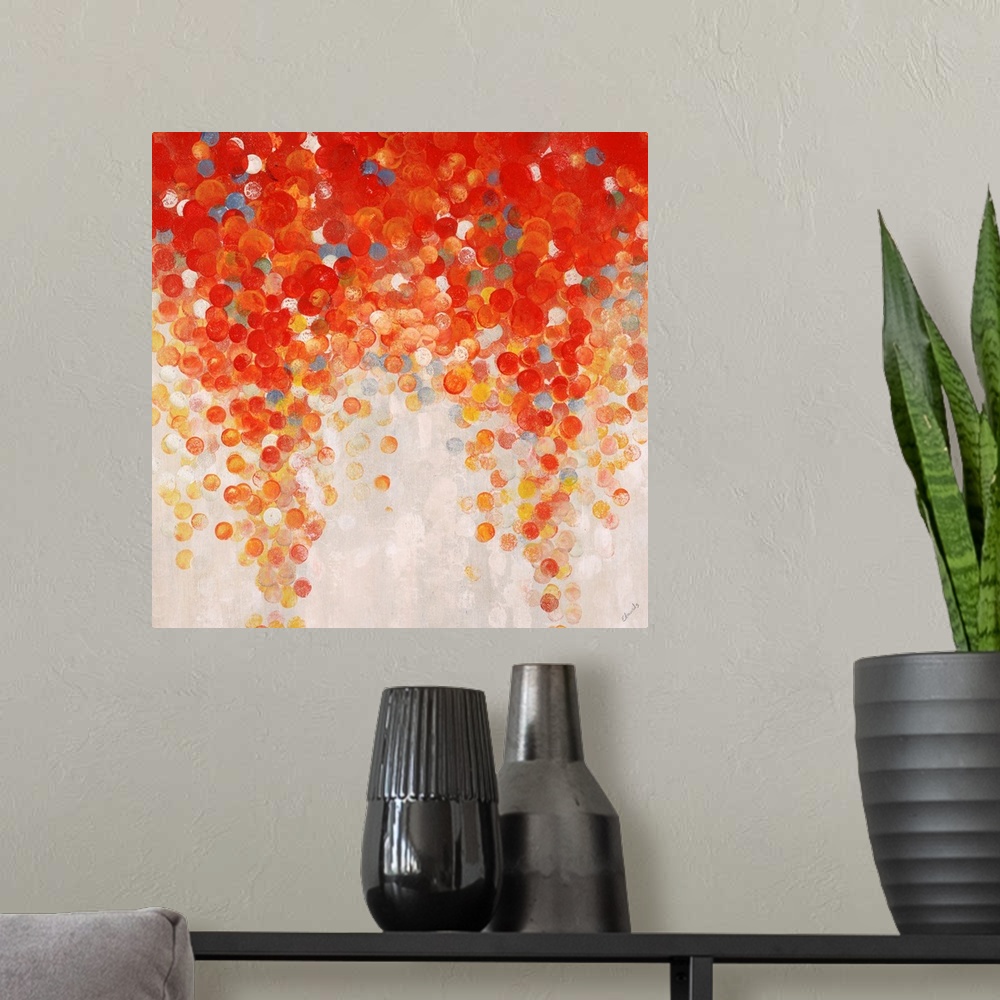 A modern room featuring Abstract painting of a large cluster of gumballs in warm tones that appear to be raining downward...
