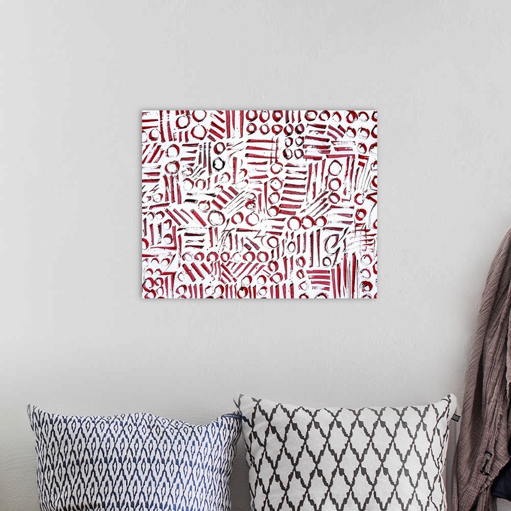 A bohemian room featuring Abstract contemporary artwork made of red circles and lines.