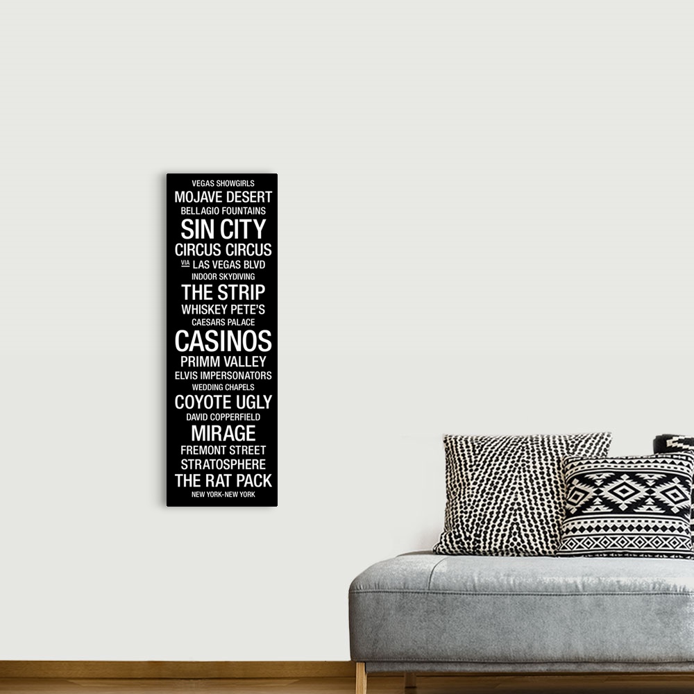 A bohemian room featuring A vertical bus roll featuring a list of many of the landmarks and icons that the city of Las Vega...