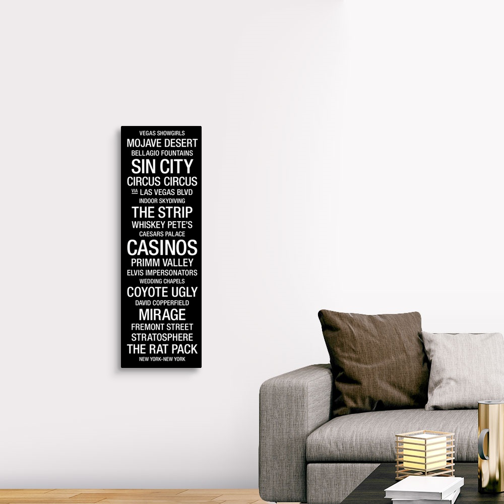 A traditional room featuring A vertical bus roll featuring a list of many of the landmarks and icons that the city of Las Vega...