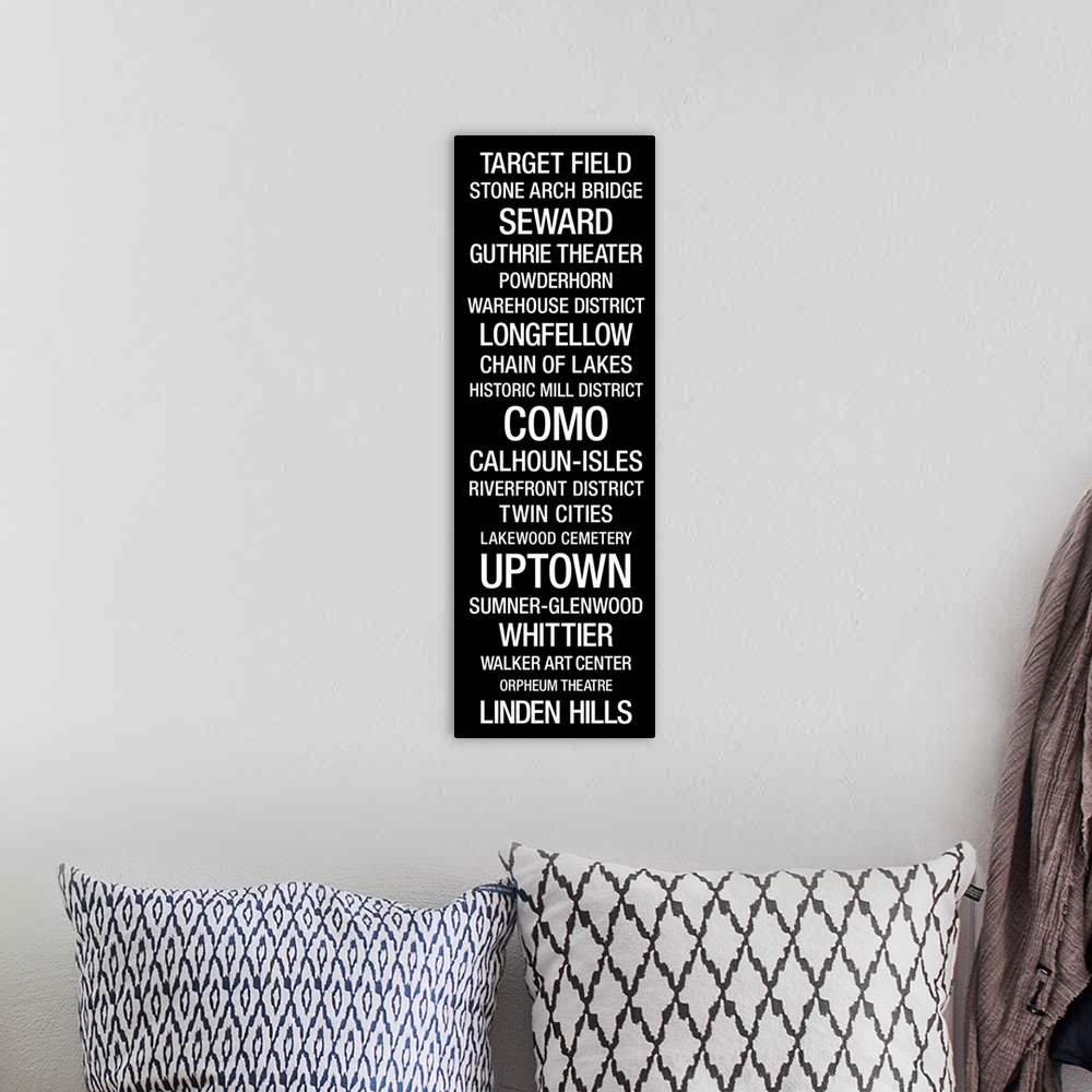 A bohemian room featuring This vertical typographic art work lists city landmarks and neighborhoods in a san serif type fac...