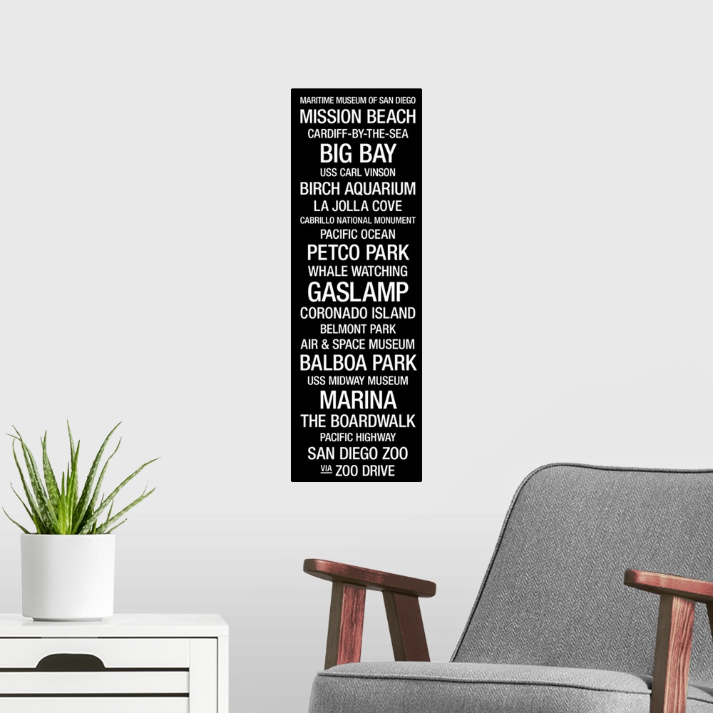 A modern room featuring Vertical panoramic artwork of typographic design that includes landmarks of popular west coast city.