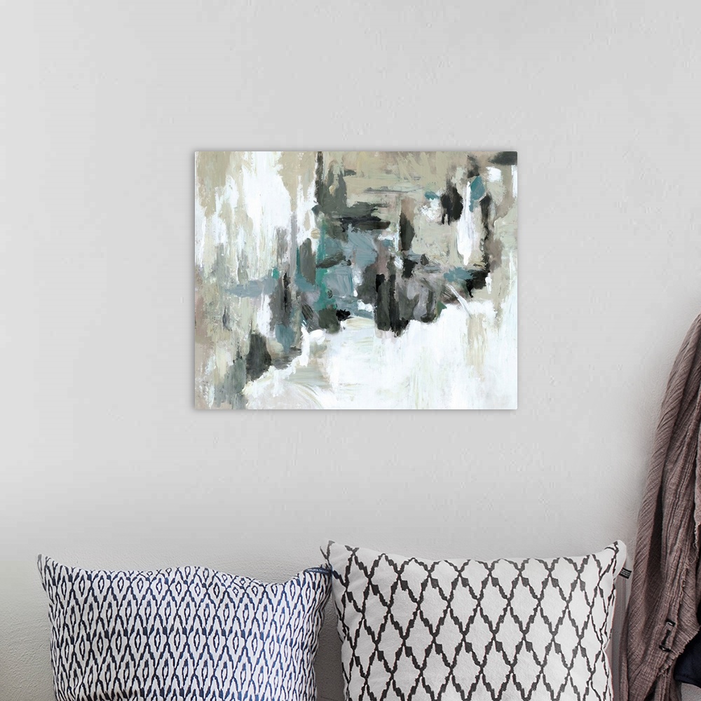 A bohemian room featuring Contemporary abstract artwork in muted blue and brown tones, resembling a moody sky.