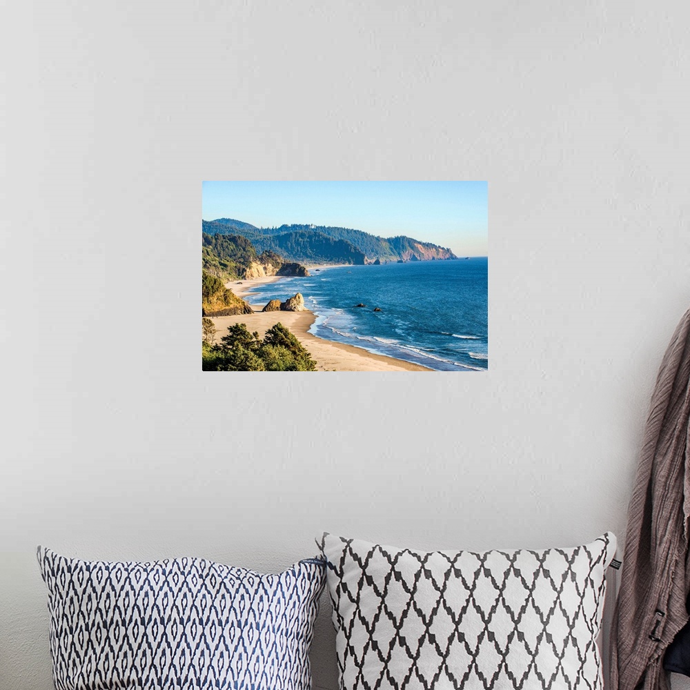 A bohemian room featuring Landscape photograph of the Pacific North West coast at Cannon Beach.