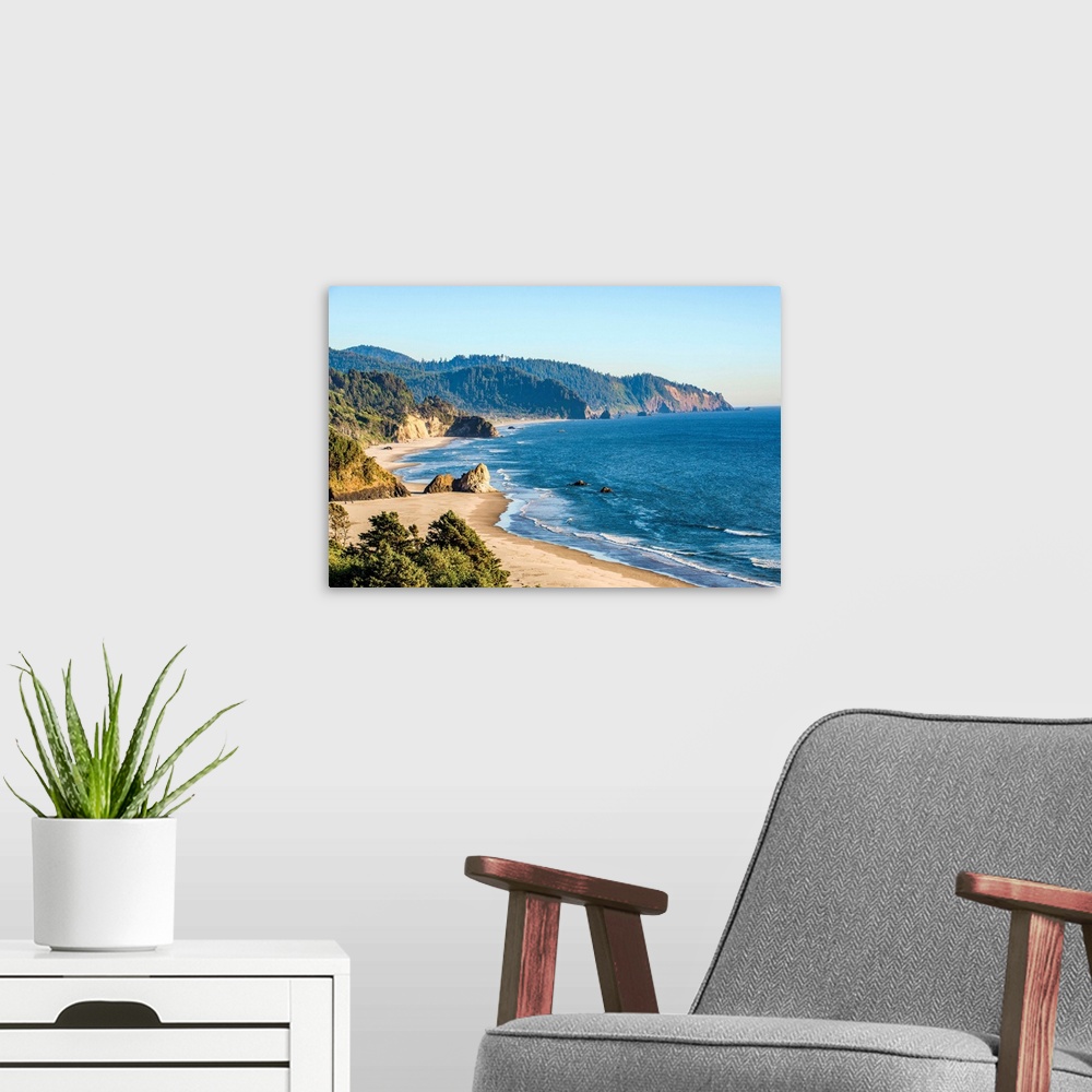 A modern room featuring Landscape photograph of the Pacific North West coast at Cannon Beach.