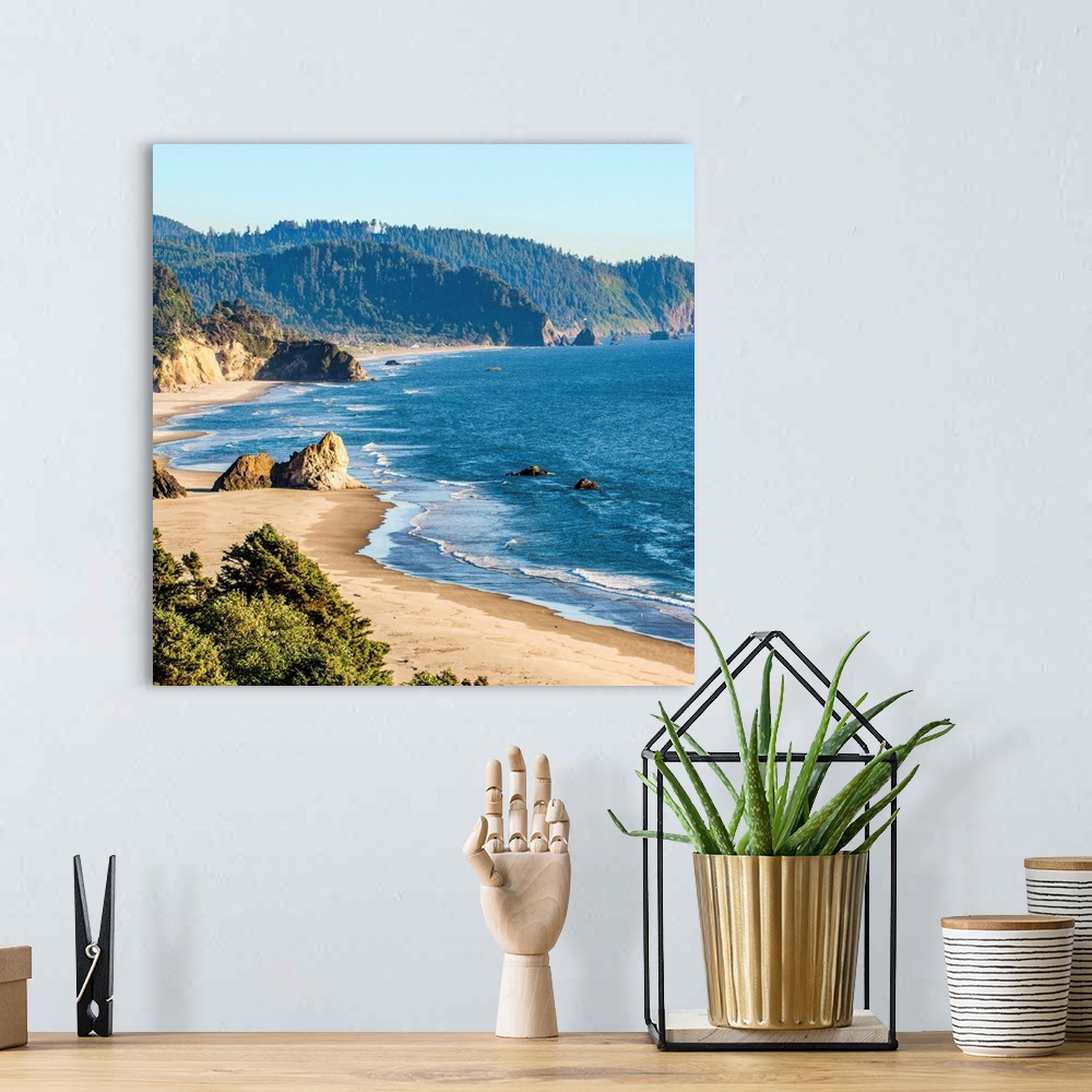 A bohemian room featuring Square photograph of the blue pacific waters on the Oregon coast at Cannon Beach.