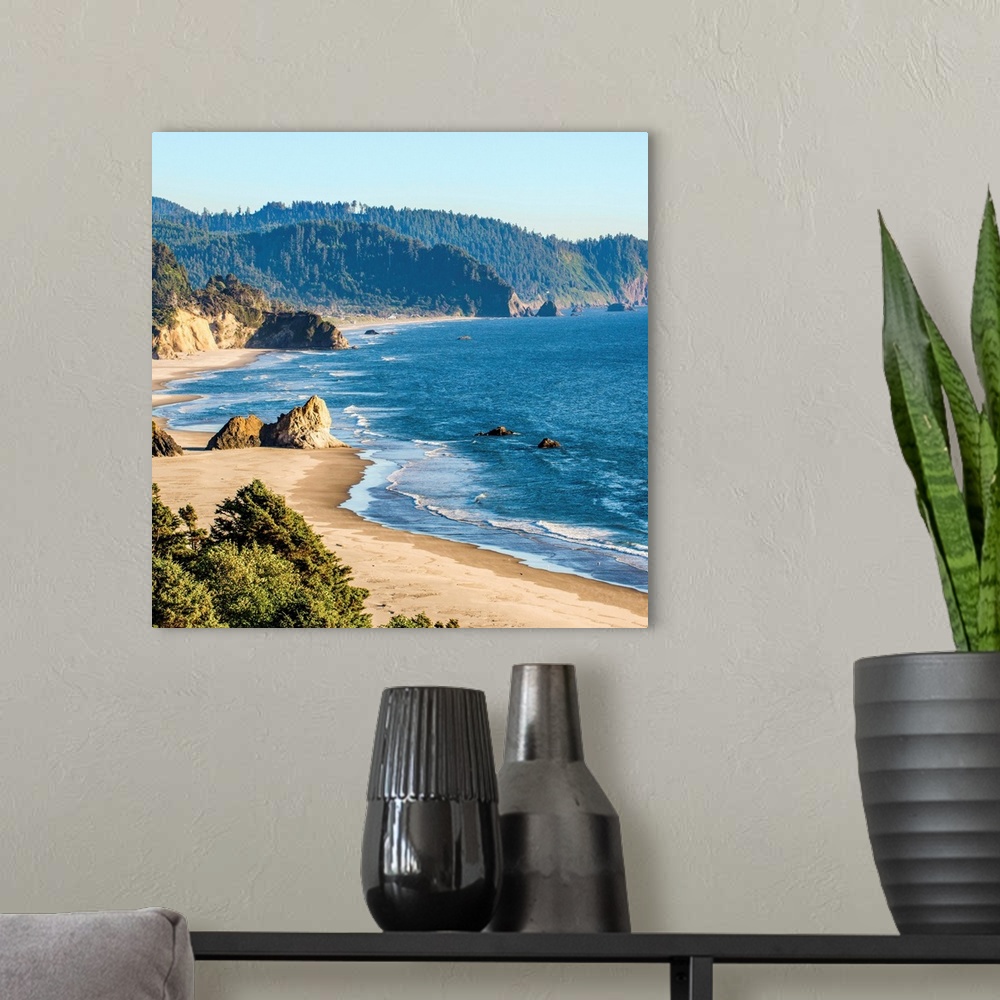 A modern room featuring Square photograph of the blue pacific waters on the Oregon coast at Cannon Beach.
