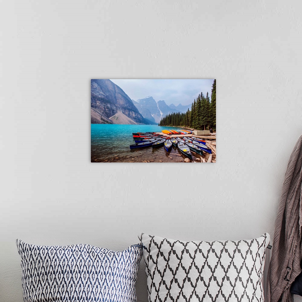 A bohemian room featuring Canoes at Moraine Lake in Banff National Park, Alberta, Canada.