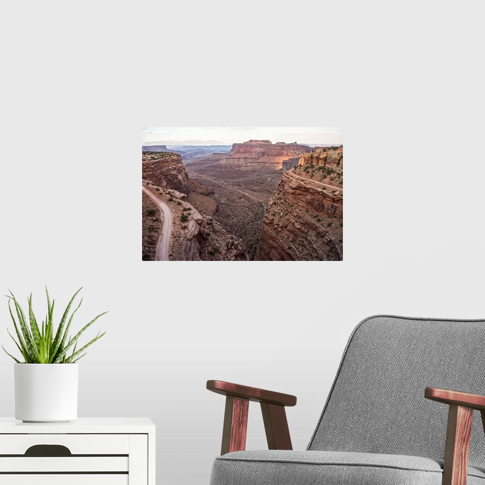 A modern room featuring View of the rocky desert landscape with mesas in the distance, seen from Shafer Trail in Canyonla...