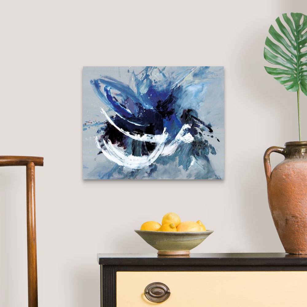 A traditional room featuring Contemporary abstract artwork in blue, black, and white in broad, fast brushstrokes.