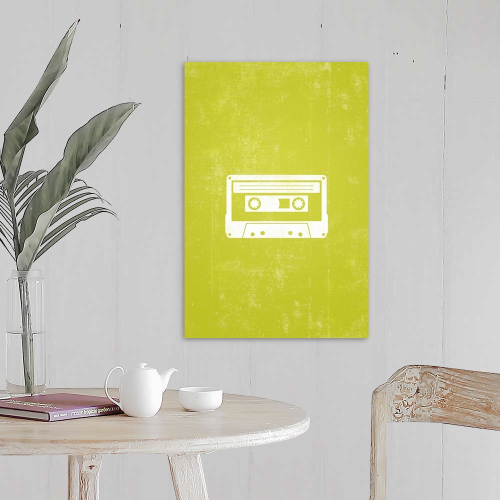 A farmhouse room featuring Retro artwork that has a silhouette of a cassette tape against a neon green background.