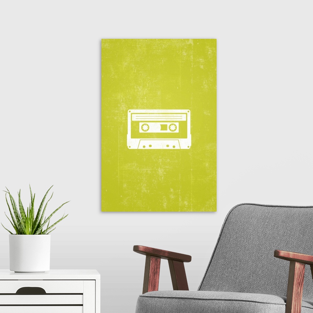 A modern room featuring Retro artwork that has a silhouette of a cassette tape against a neon green background.