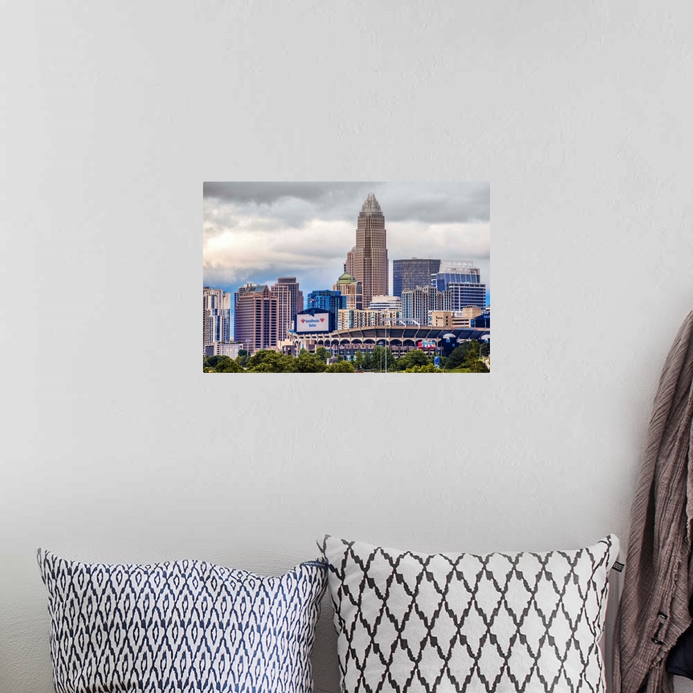 A bohemian room featuring Horizontal image of the city of Charlotte, North Carolina with a cloudy sky.