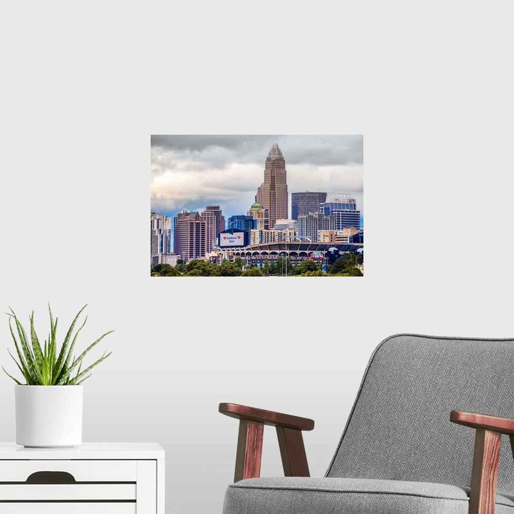 A modern room featuring Horizontal image of the city of Charlotte, North Carolina with a cloudy sky.