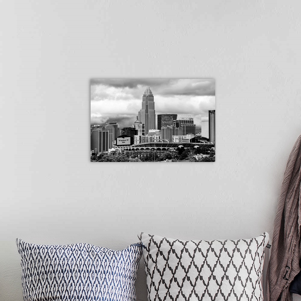 A bohemian room featuring Horizontal image of the city of Charlotte, North Carolina with a cloudy sky.