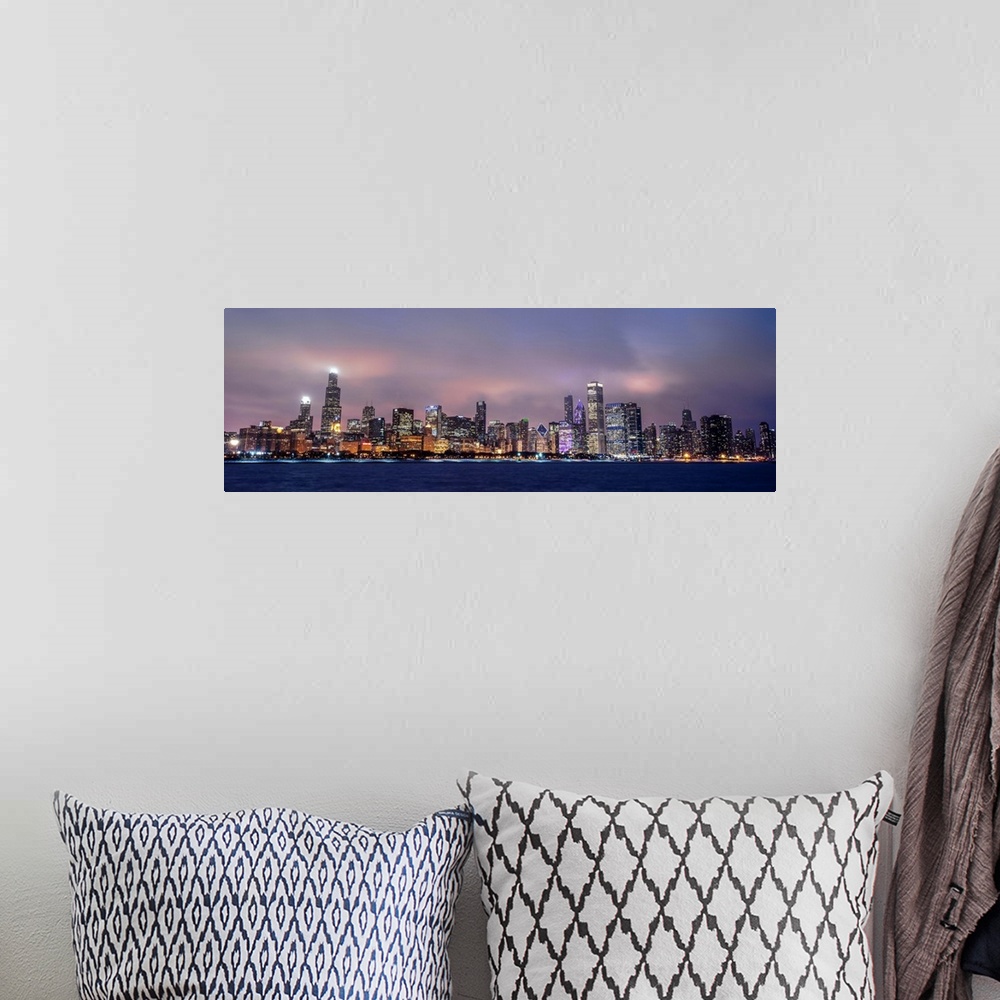 A bohemian room featuring Panoramic view of the Chicago city skyline in the early evening, with city lights reflecting off ...