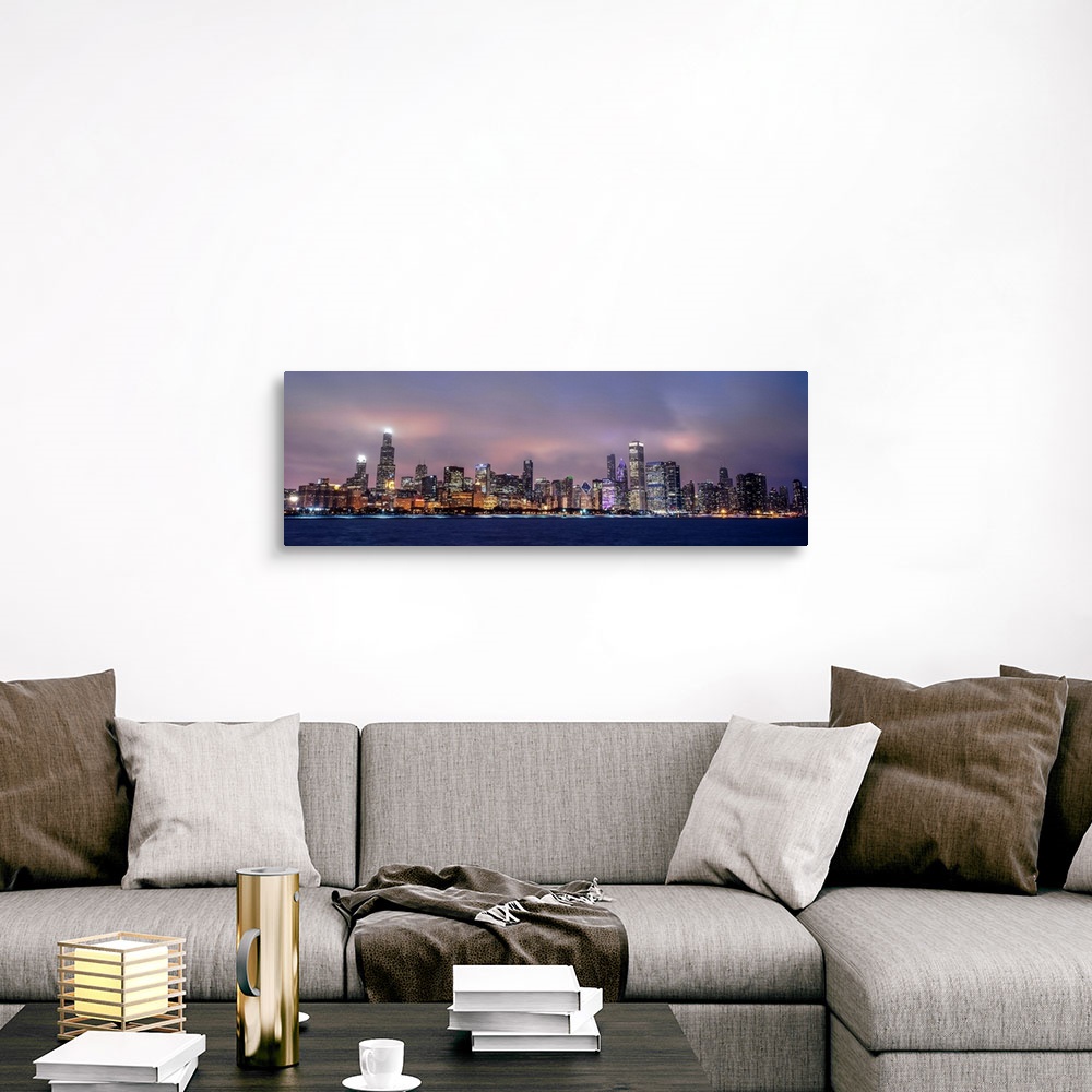 A traditional room featuring Panoramic view of the Chicago city skyline in the early evening, with city lights reflecting off ...