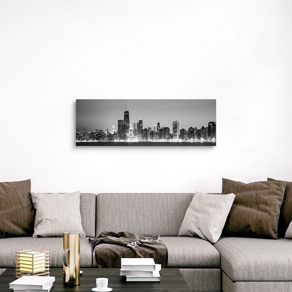 A traditional room featuring Panoramic view of the Chicago city skyline illuminated in the early evening, seen from across the...