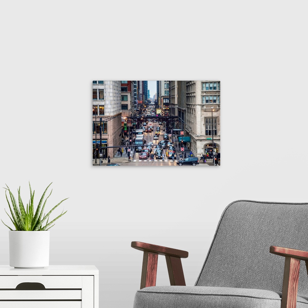 A modern room featuring Photo of one of Chicago's bustling streets, Monroe Street.
