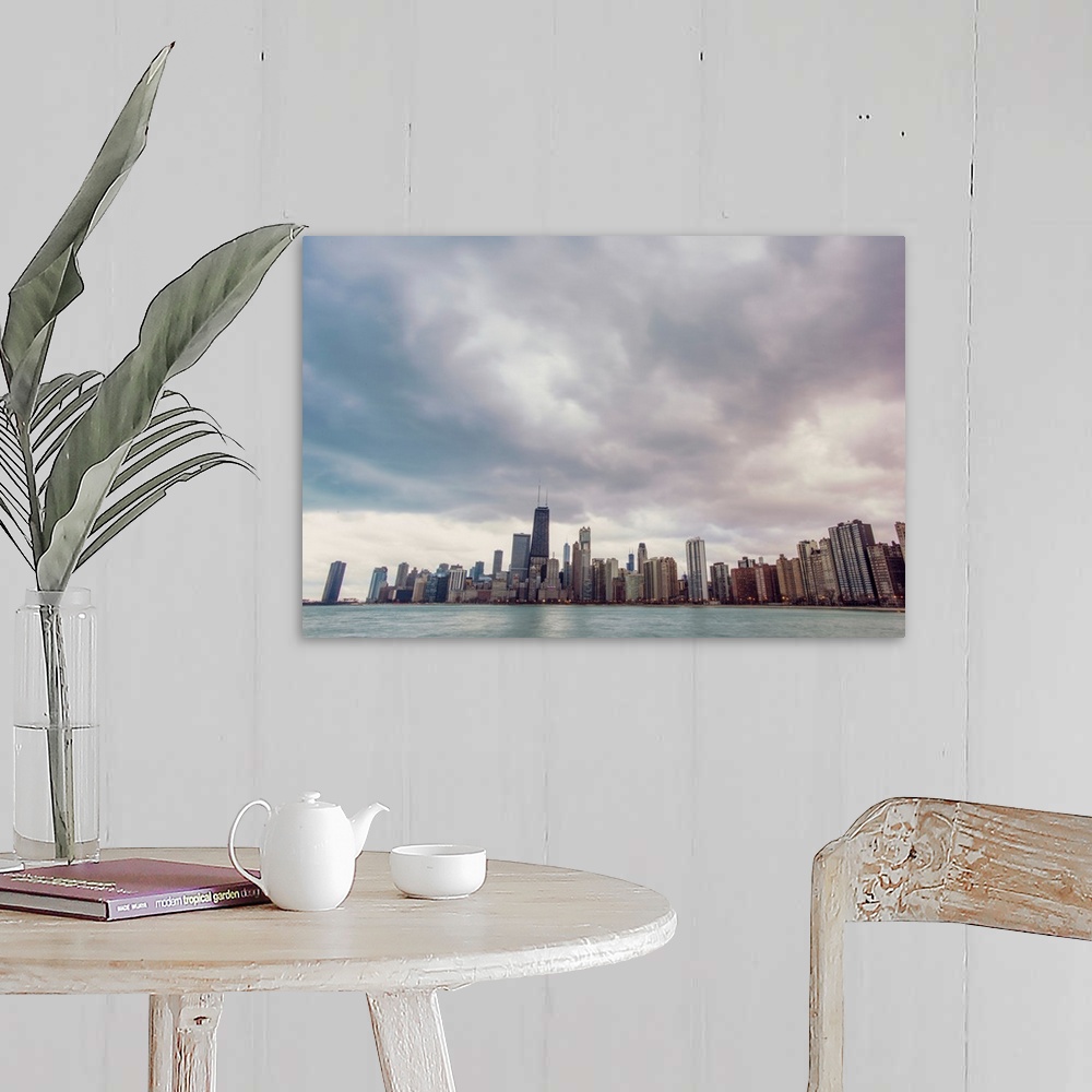 A farmhouse room featuring Photo of Chicago's skyline under dramatic clouds.